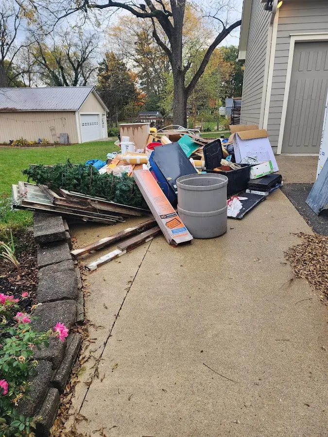 Dumpster being loaded with debris for Commercial Dumpster Rental in Taunton